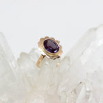 Ring in 585 Gelbgold mit lila Stein